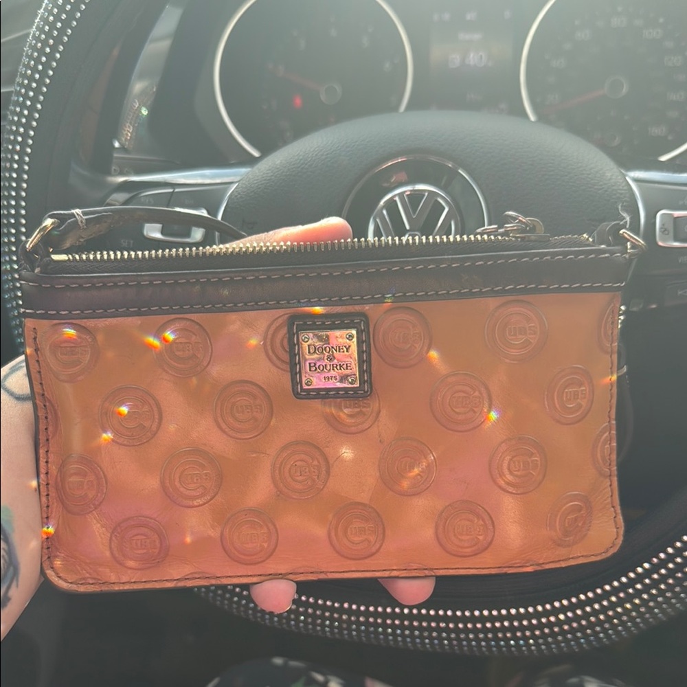 Dooney & Bourke Tan Clutch with cubs Signature Monogram